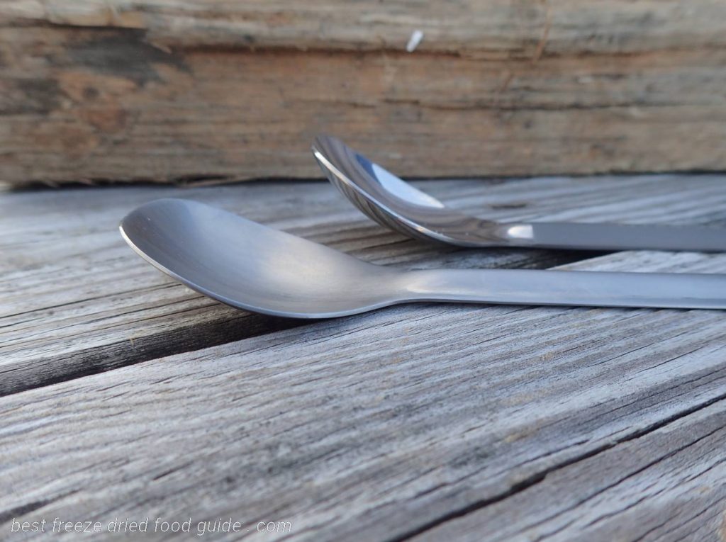The business end of the long handle titanium spoons compared. Note the TOAKS spoon is much more angled than the REI spoon.
